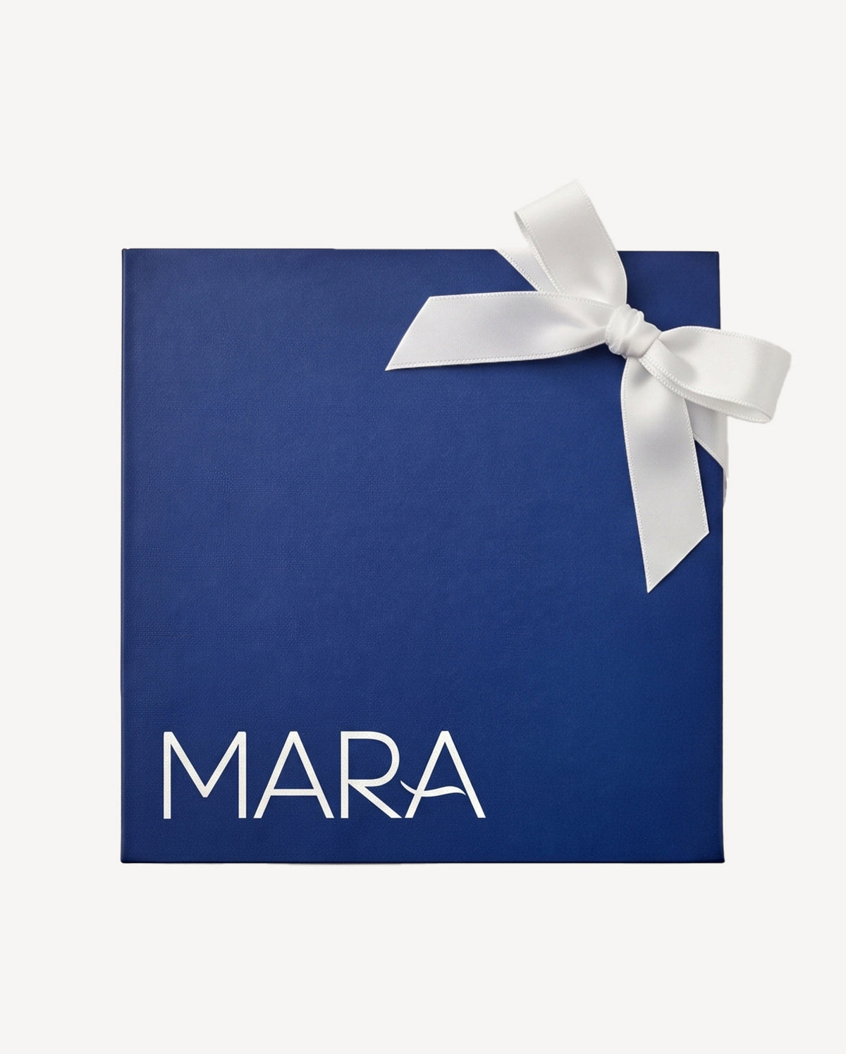 Navy gift box with MARA logo with white bow in the corner