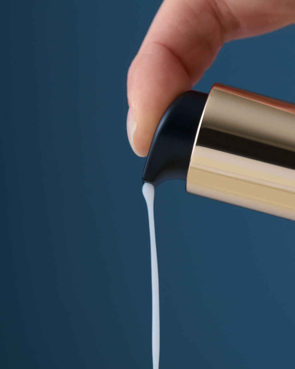 Pearl Peptide Glaze pumped on blue background