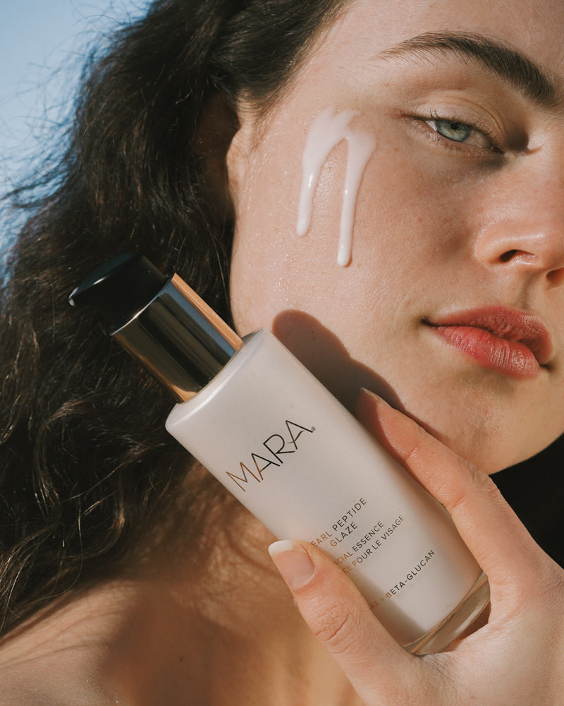 model with Pearl Peptide Glaze dripping down face