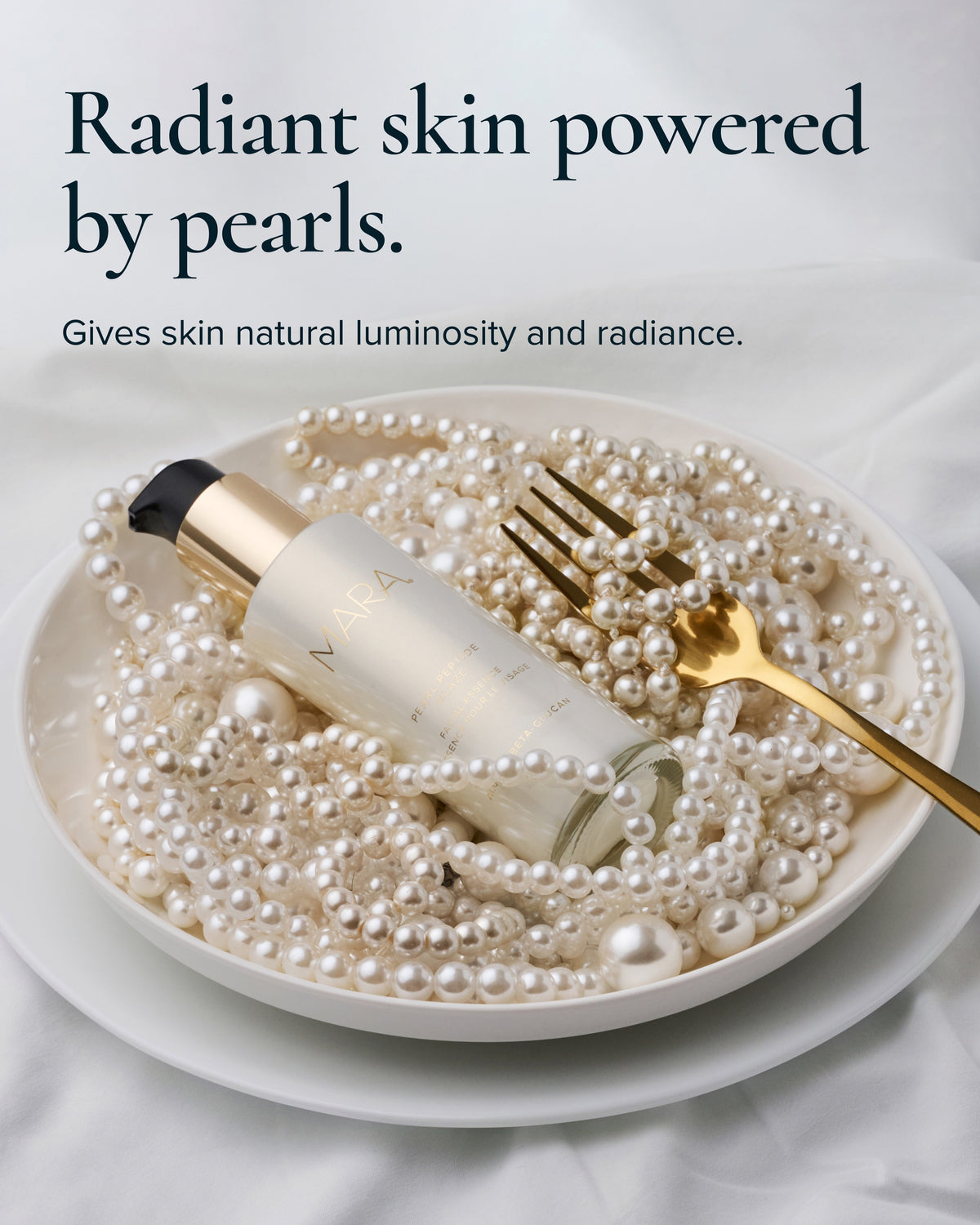 Pearl Peptide Glaze lies on a bed of pearls inside a white bowl, with a gold fork resting on top. Text at the top reads, 'Radiant skin powered by pearls.