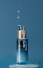 Sea Kale Sunscreen Serum with product spilling over it