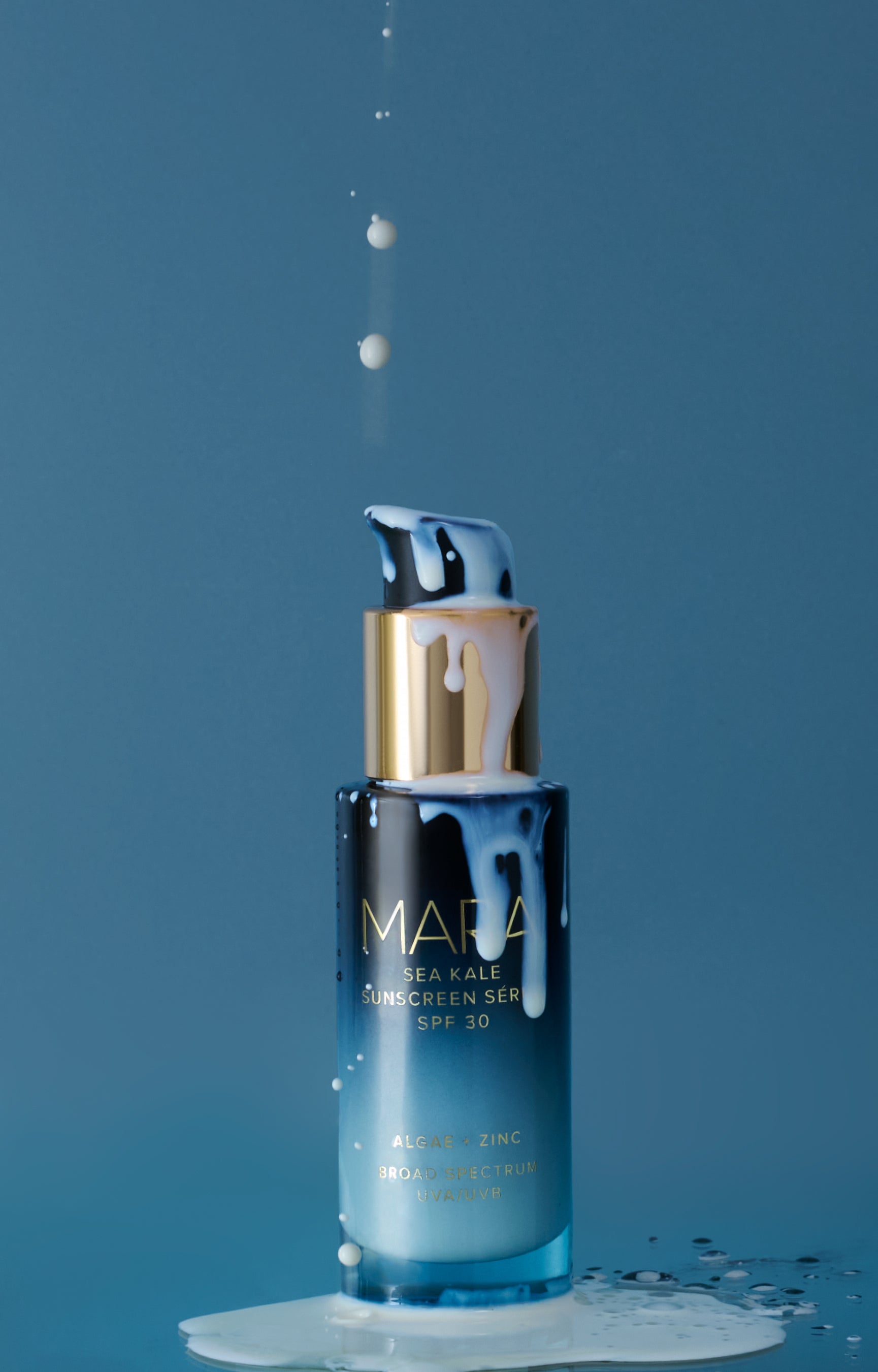 Sea Kale Sunscreen Serum with product spilling over it