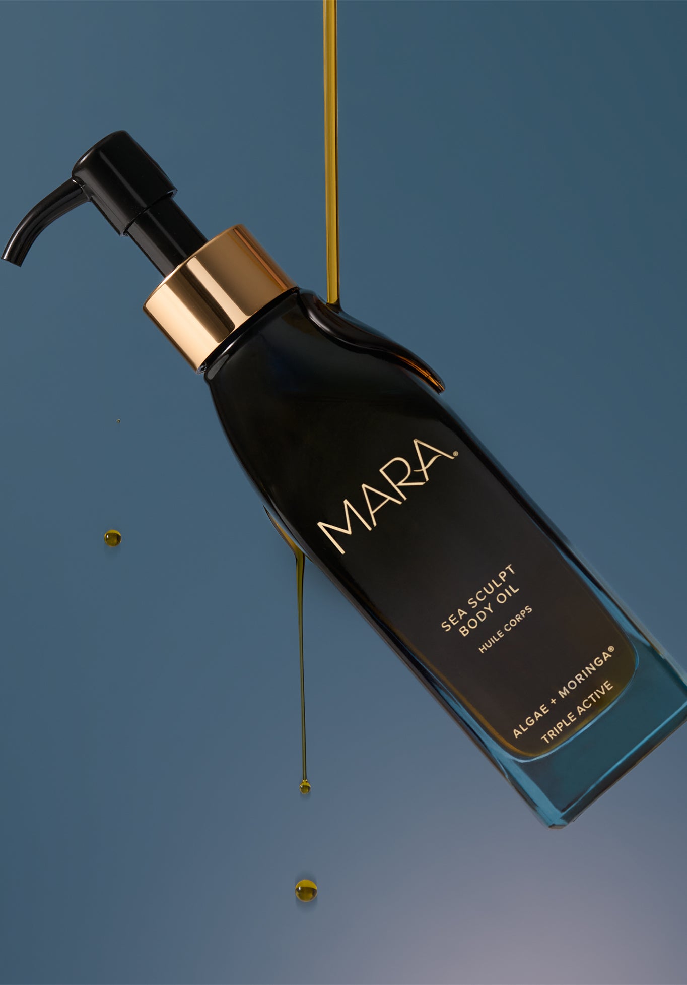 Sea Sculpt Body Oil with oil dripping on it