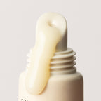 Close up Clear Sea Silk Lip Balm with product spilling out