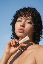 Model wearing Sea Silk Lip Balm in Clear