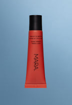 Sea Silk Lip Balm Soft Coral on a blue background