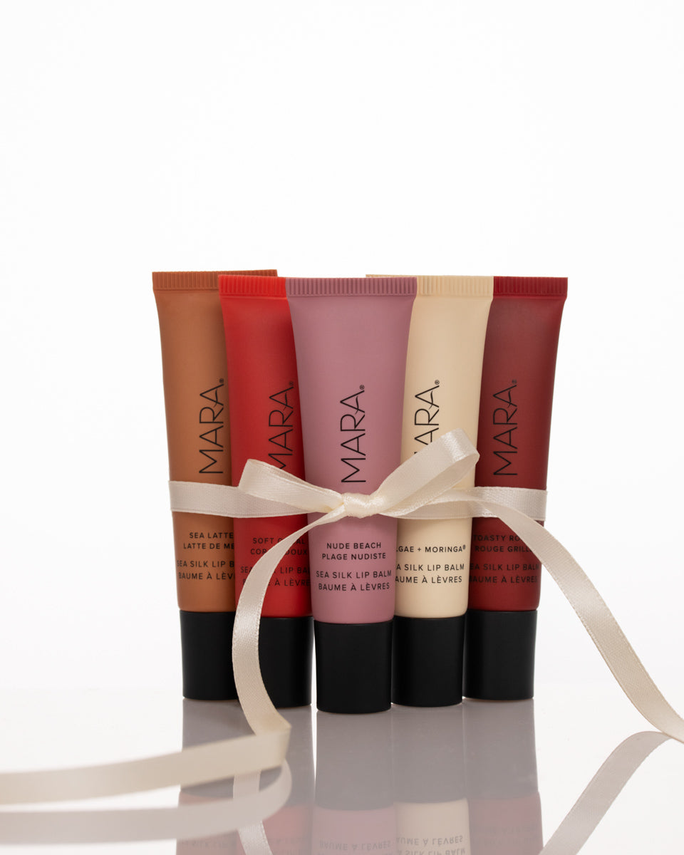 five shades of Sea Silk Lip Balm wrapped with white ribbon
