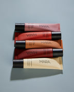 five shades of Sea Silk LIp Balm on blue surface