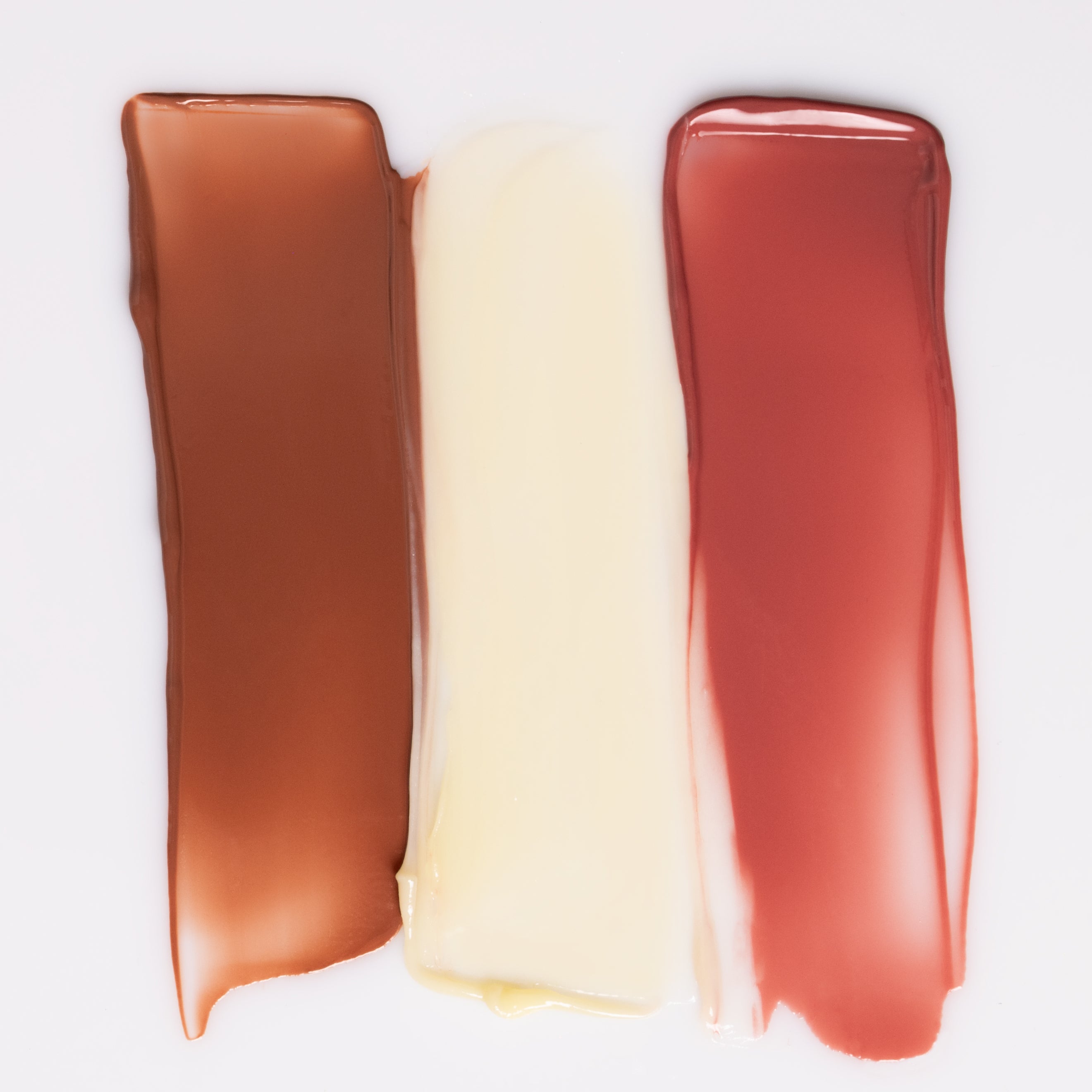 Three swatches of Sea Silk Lip Balm shades on a white background