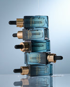 Stack of Sea Vitamin C Serum bottles on a reflective surface