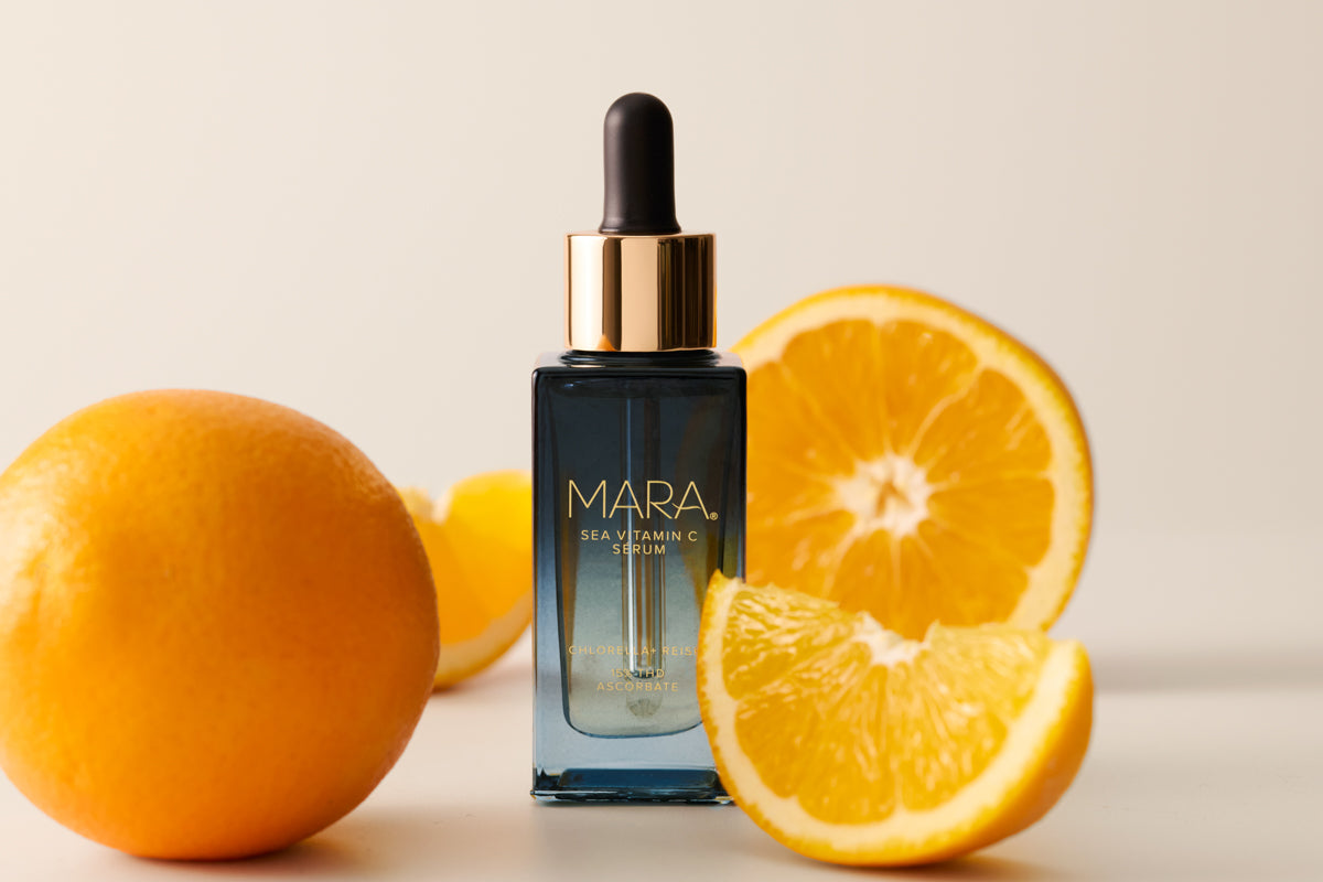 MARA Sea Vitamin C Serum with oranges on a light background
