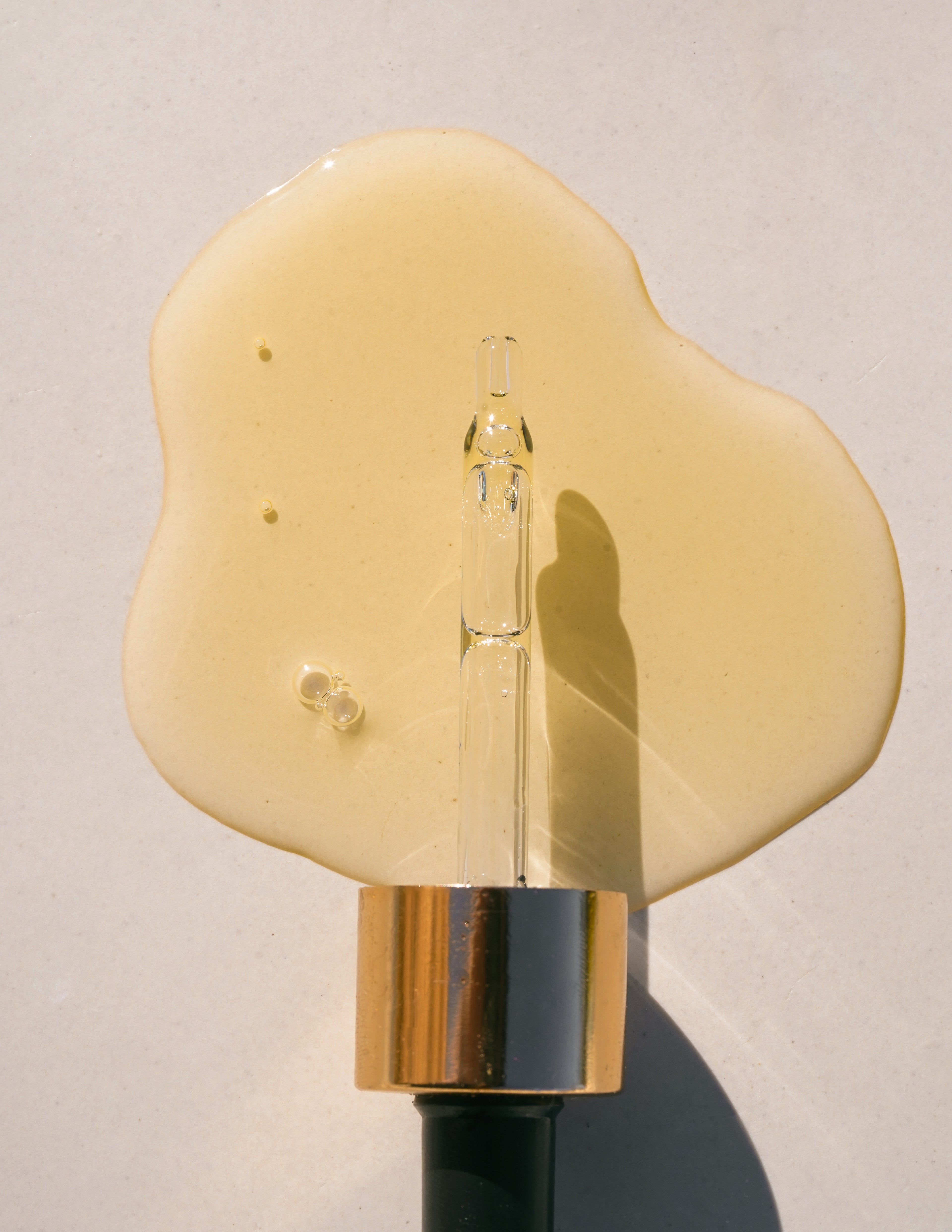 Universal Face Oil swatch with dropper