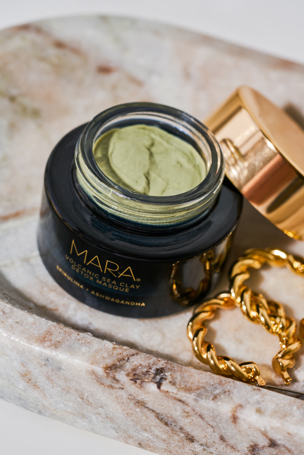 open Volcanic Sea Clay Detox Masque on a marble tray
