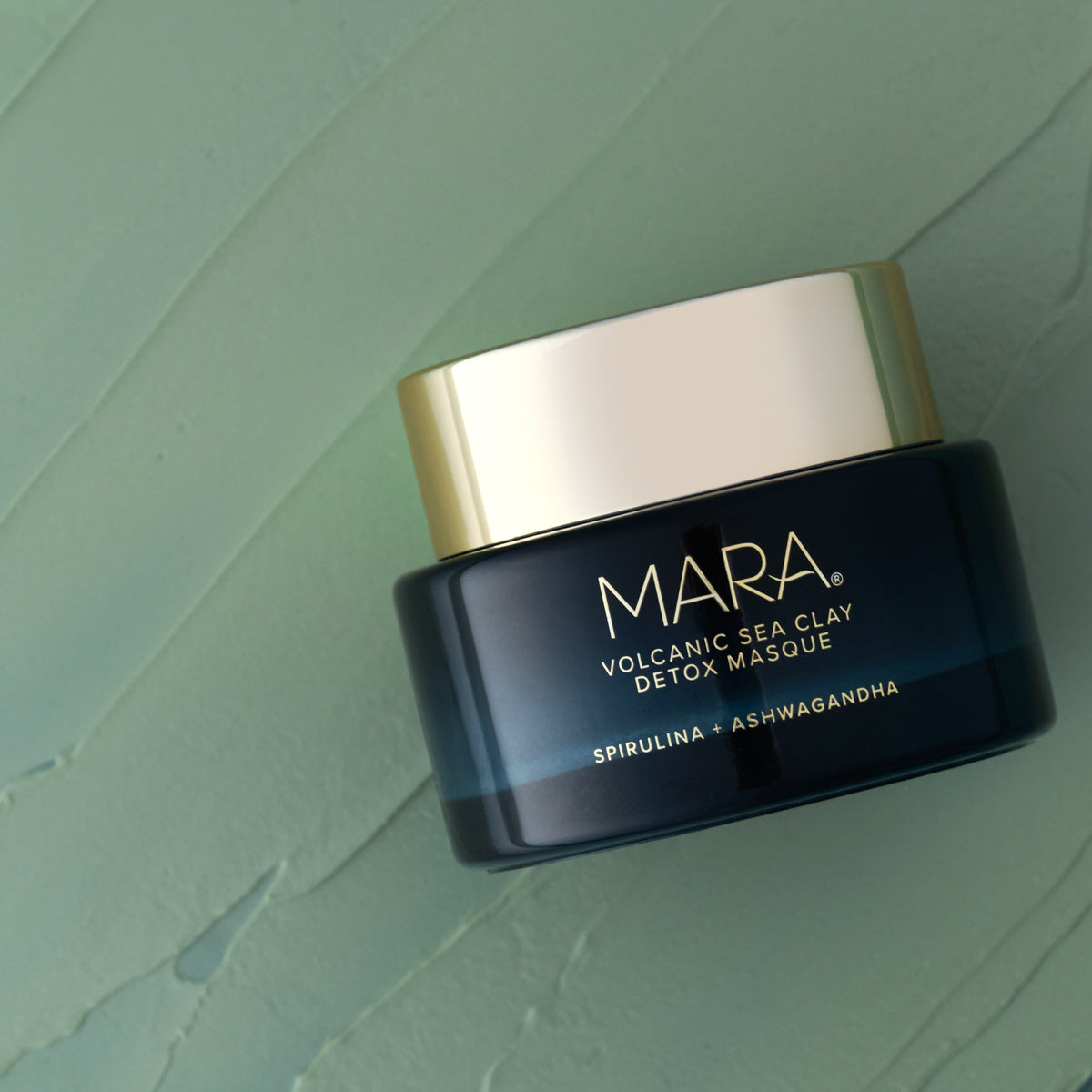 Volcanic Sea Clay Detox Masque jar on texture