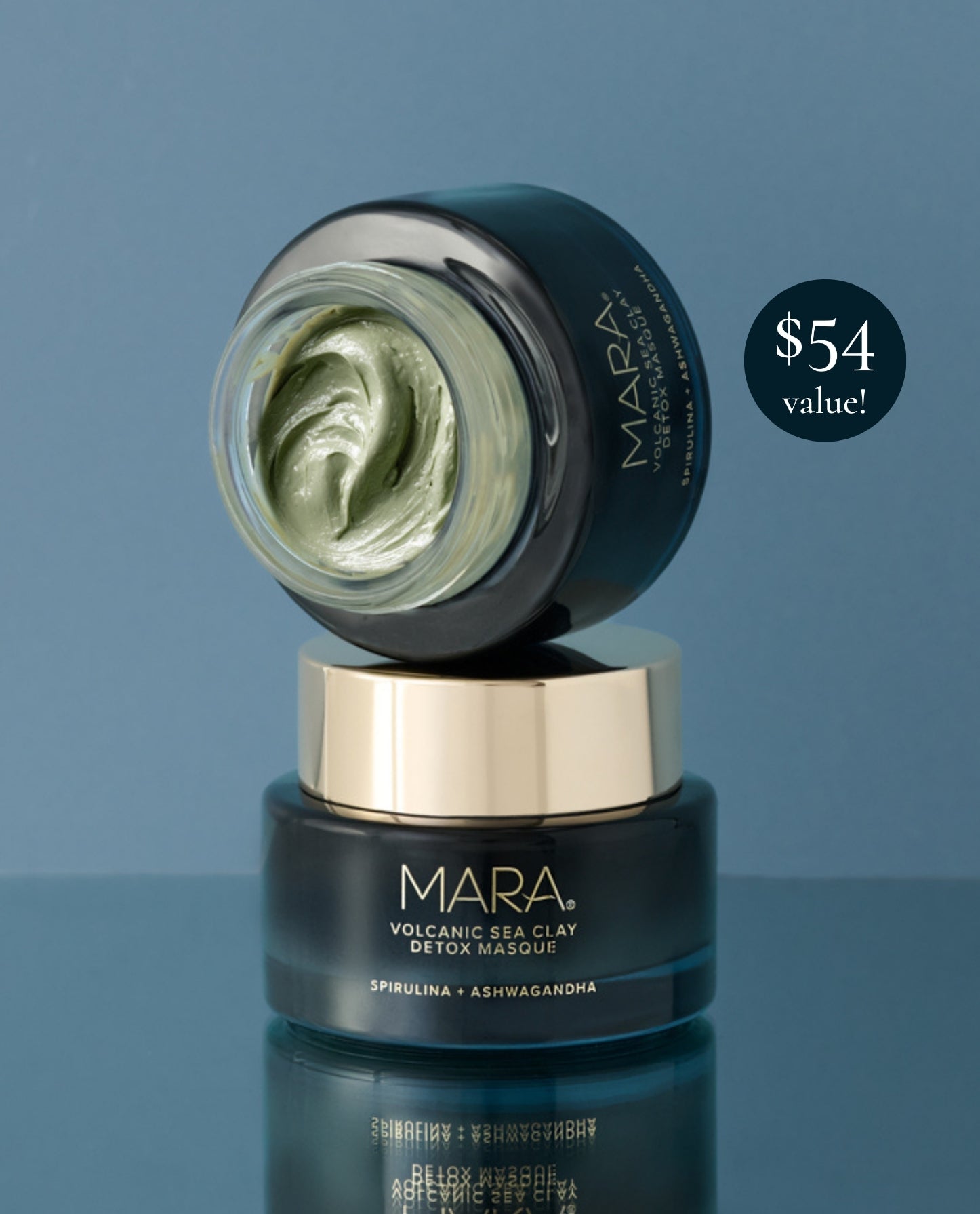 MARA Volcanic Sea Clay Detox Masque jar with one open lid resting on top of the closed jar, showing the pale green mask inside, set against a slate blue background with a '$54 value!' badge.