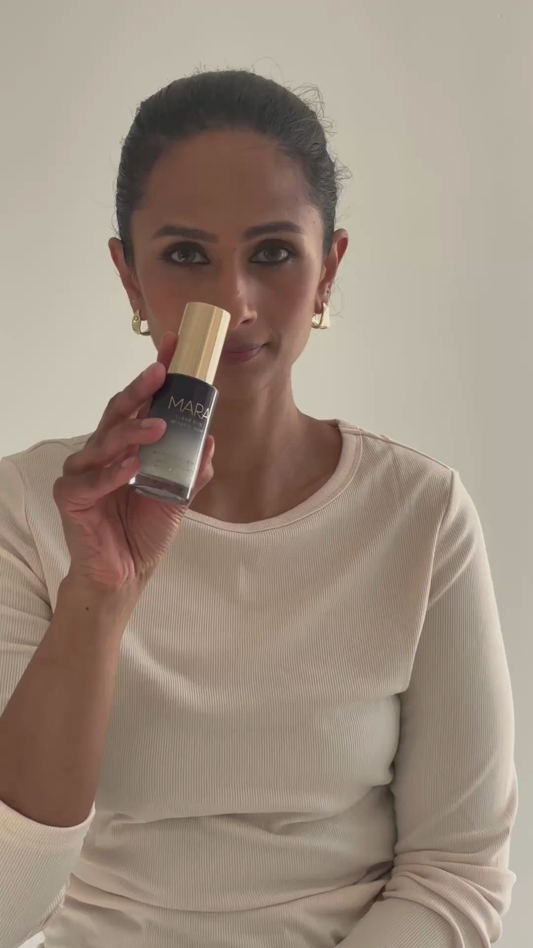 woman using Clear Skin Mineral Milk