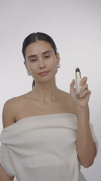 Woman using Mini Pearl Peptide Glaze
