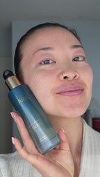 woman using Aura Cleanse Foaming Gel Cleanser 