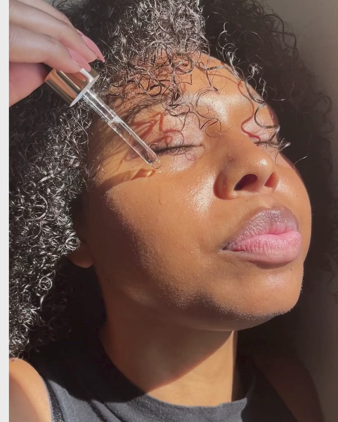 applying drops of SVCS on the face