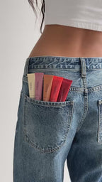 MARA sea silk lip balm swatches in jean back pocket on model