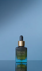 water splashing on Universal Face Oil 