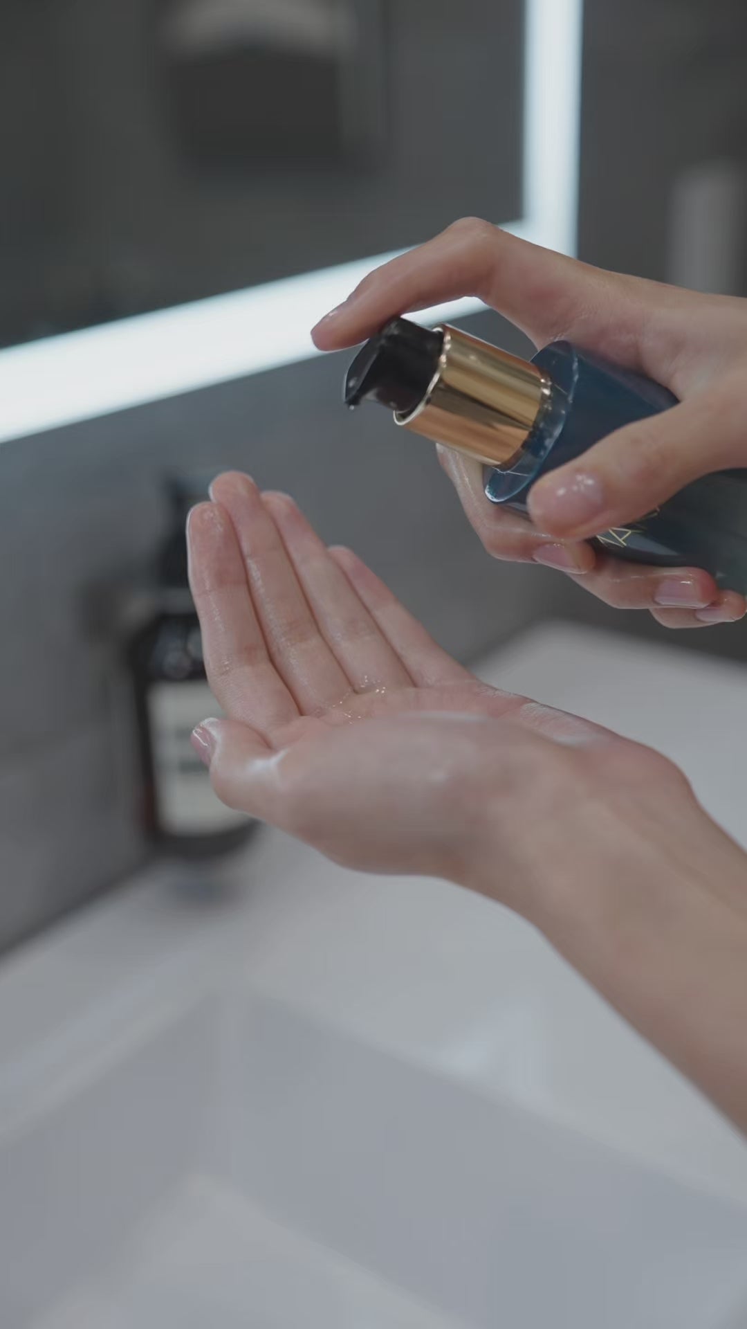 Woman using Aura Cleanse Foaming Gel Cleanser in the bathroom, doing the whole routine